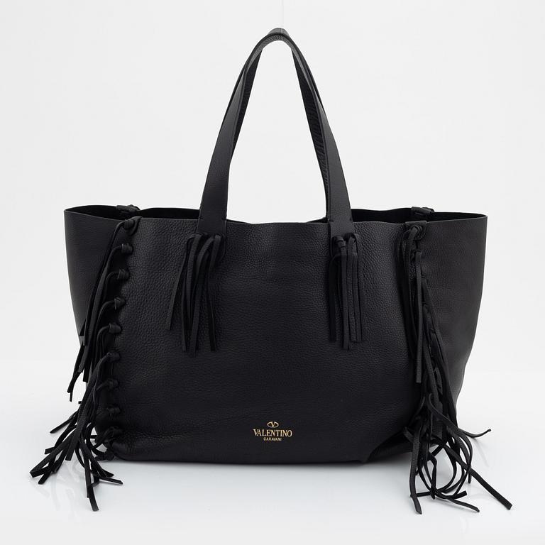 Valentino Garavani, a black leather fringe bag.