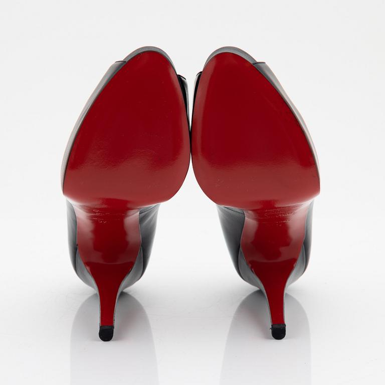 Christian Louboutin, a pair of black leather peep toe pumps, size 37 1/2.