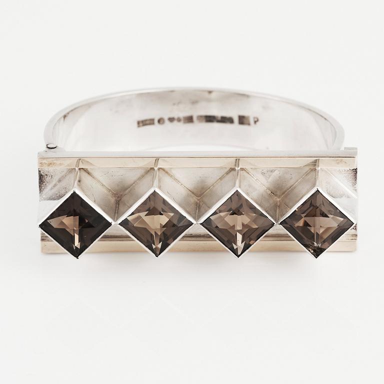 Sigurd Persson, a sterling silver, part gilt bangle with smoky qvartz (citrine), Stockholm 1963, executed by silversmith Peter Schmitt.