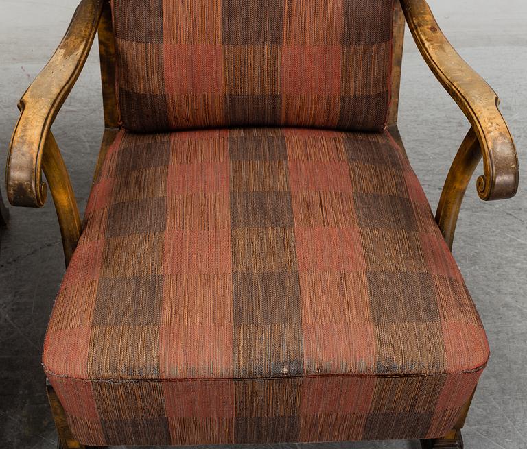 A pair of 1920s easy chairs.