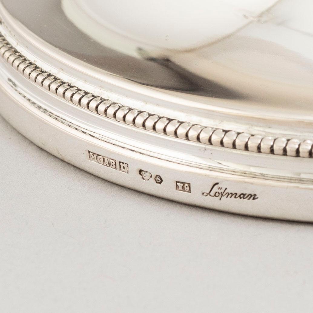 A set of four Swedish silver candlesticks, maker's mark Erik Löfman, Uppsala 1971-1973.