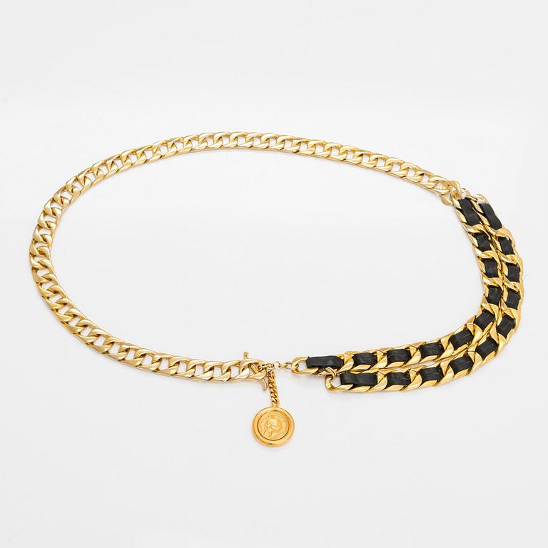 Chanel, a gold coloured metal and leather belt. Marked Coco Chanel Paris.