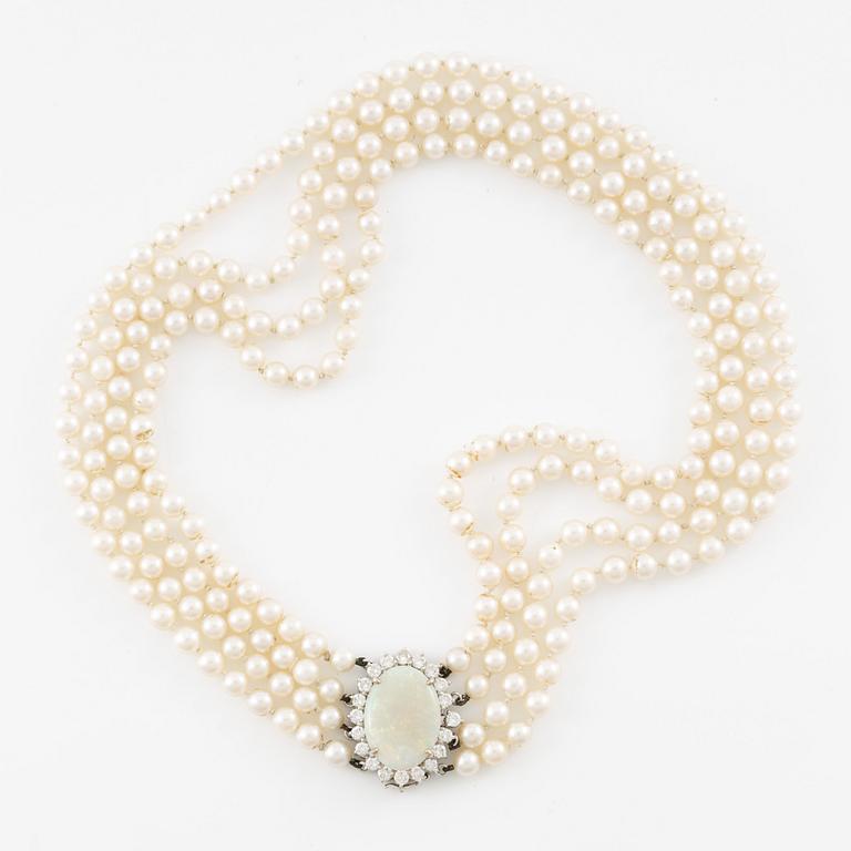 Necklace, four-row with cultured pearls, clasp 18K white gold set with opal and brilliant-cut diamonds.