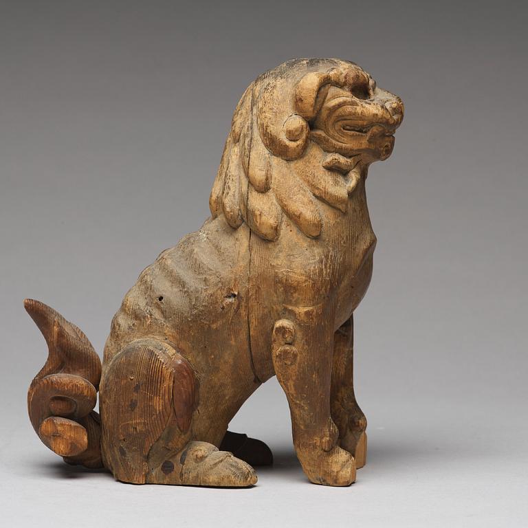 A wooden sculpture of a buddhist lion, Qing dynasty, 19th Century.