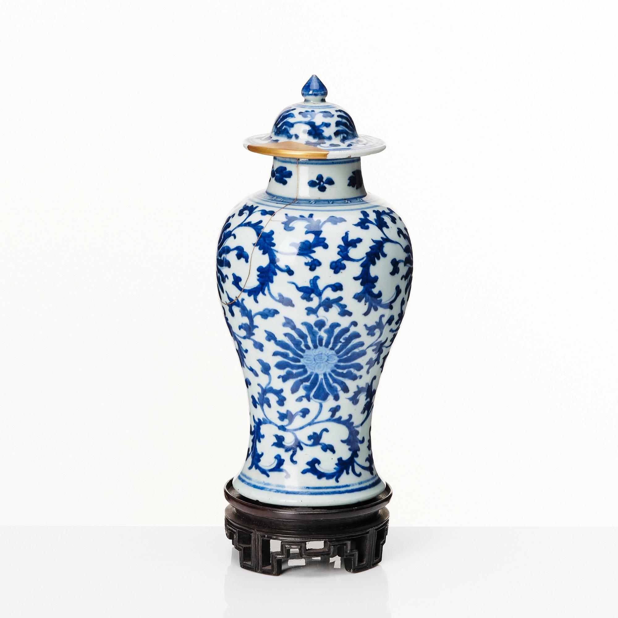 A Chinese blue and white lotus vase with cover, Qing dynasty, 18th Century.