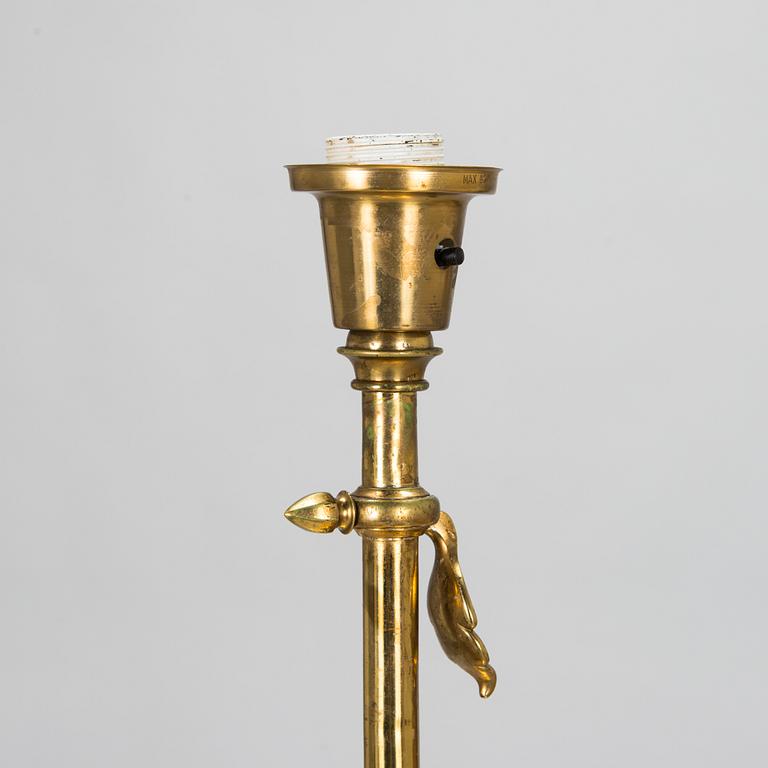 An empire style brass floor lamp, first half of the 20th Century.