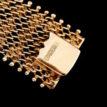 ARMBAND, 18 k guld. Vikt ca 35 g.