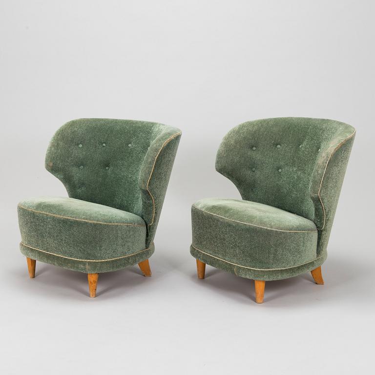 A pair of mid-20th-century armchairs.