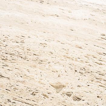 A travertine  'Epic Dining Table' from Gubi.