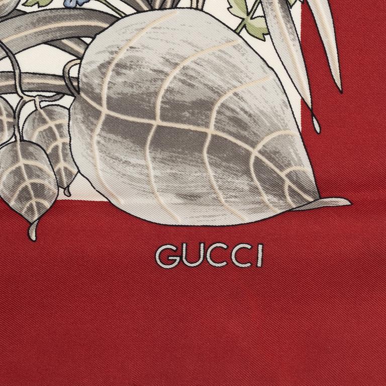 Gucci, a silk scarf.