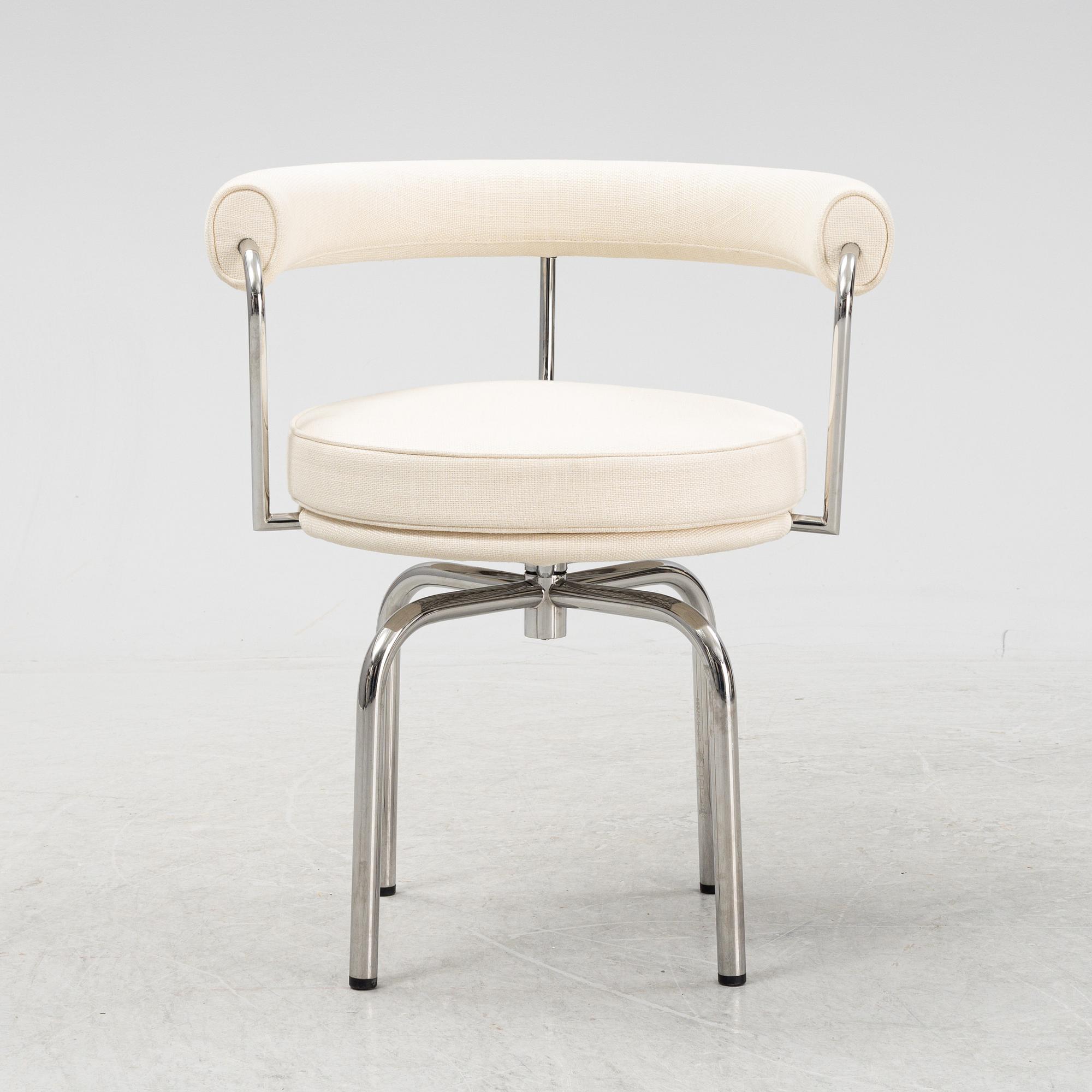 A LC 7 swivel chair by Charlotte Perriand & Pierre Jeanneret & Le Corbusier for Cassina, designed in 1927.
