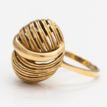 A pair of earrings and a ring made of 14K gold.