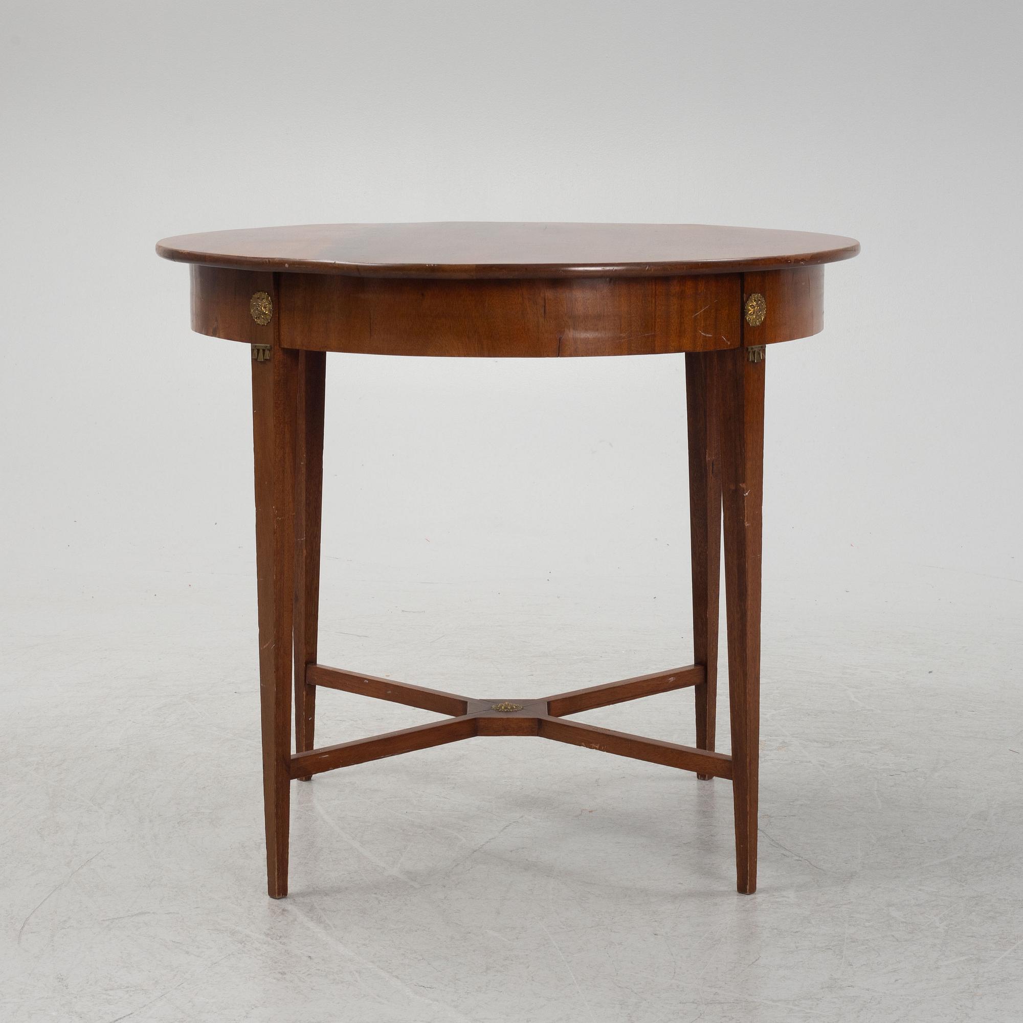A mahogany veneered table, late 19th century.