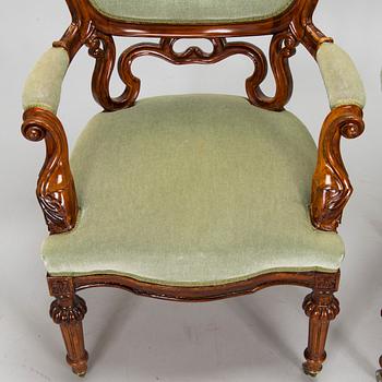 A pair of Russian armchairs and a table, late 19th century.