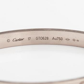 Cariter, An 18K white gold "Love" bracelet.