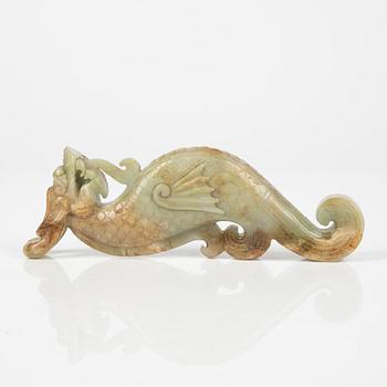 A Chinese nephrite sculpture on a wooden stand, 20th Century.