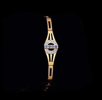 ARMBAND, 18k rödguld besatt med diamanter och safirer. Vikt 11 g.