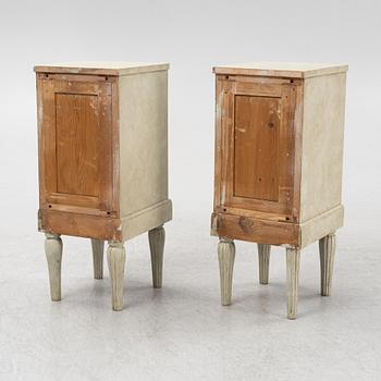 A pair of painted bedside tables. 20th Century.