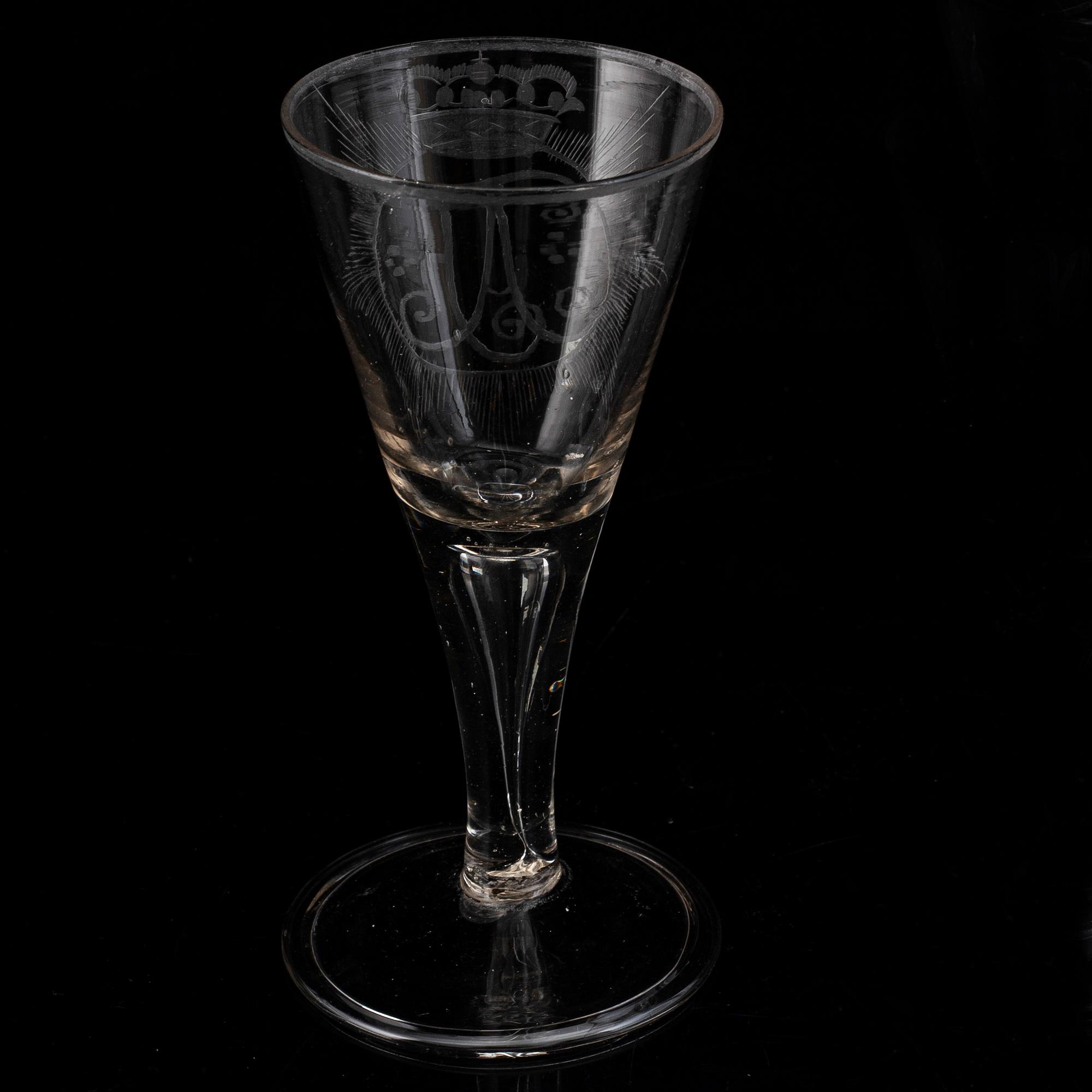 A wine glass with the monogram of the Swedish king Adolf Frederick, 18th Century.
