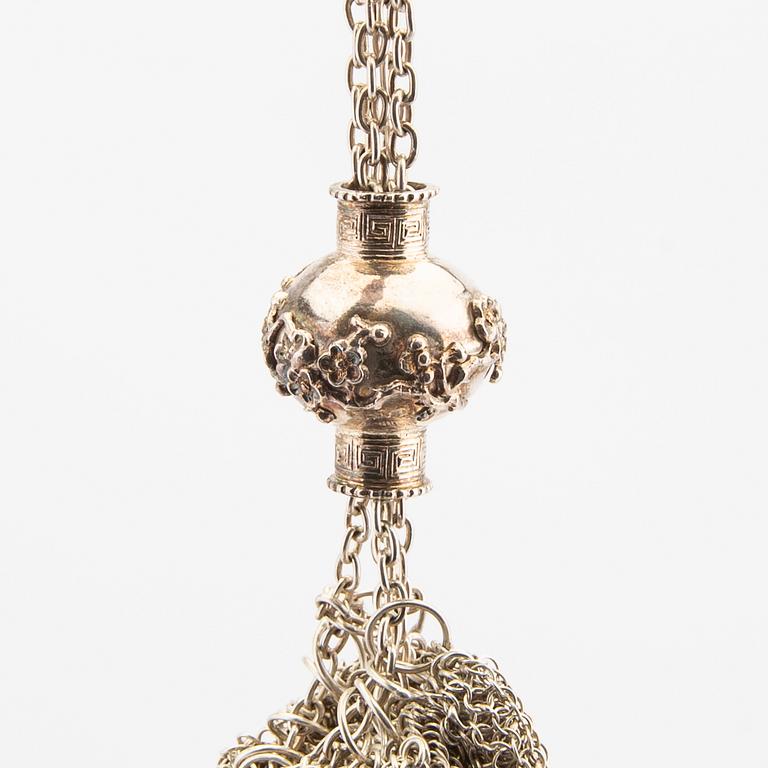 An Asian early 1900s silver bag, weight 396 grams.