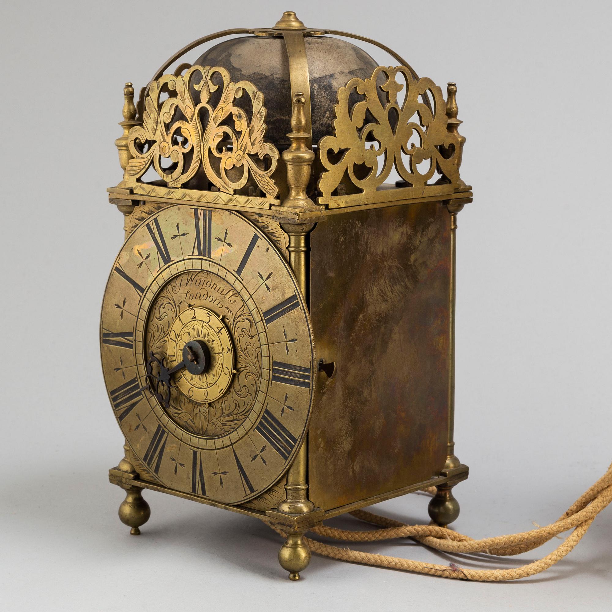 A late 17th or early 18th century lantern clock signed J Windmills London.