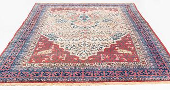 An antique Tabriz carpet, ca 333 x 223 cm.
