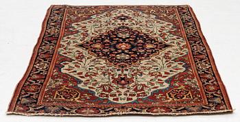 An antique Sarouk rug Western Iran, c 160 x 96 cm.
