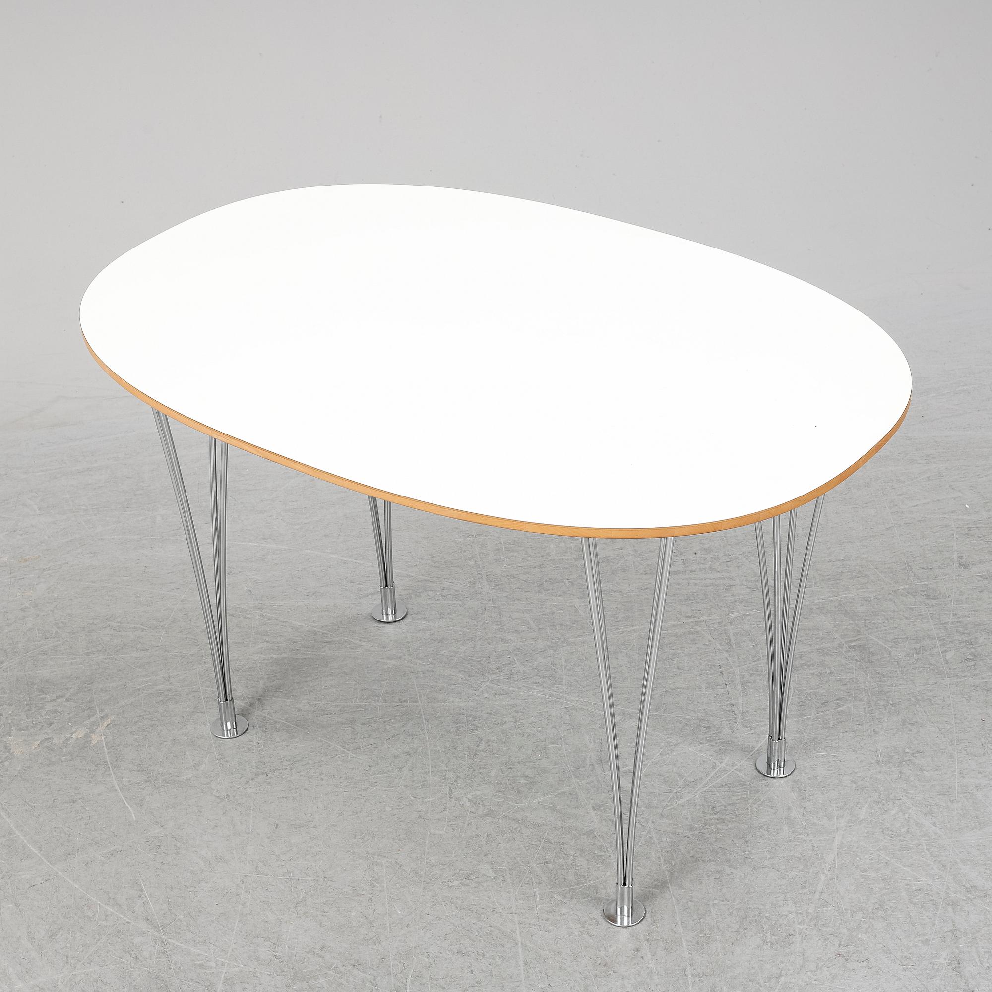 A 'Superellips" table by Bruno Mathsson & Piet Hein for Mathsson International darted 2011.