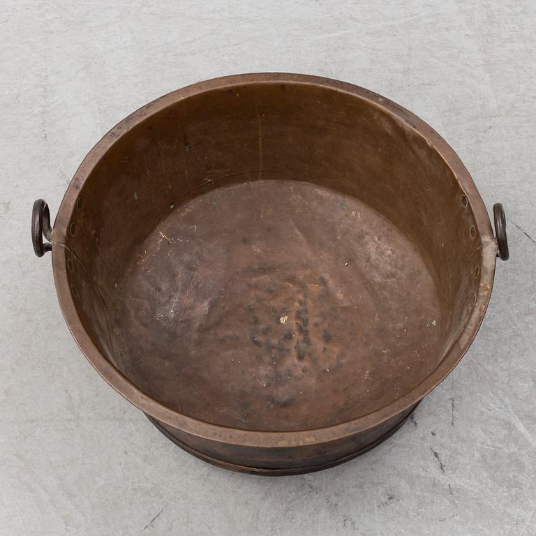 A 19th century copper cauldron.