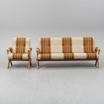 A 1960/70's pine sofa, armchair and coffee table.