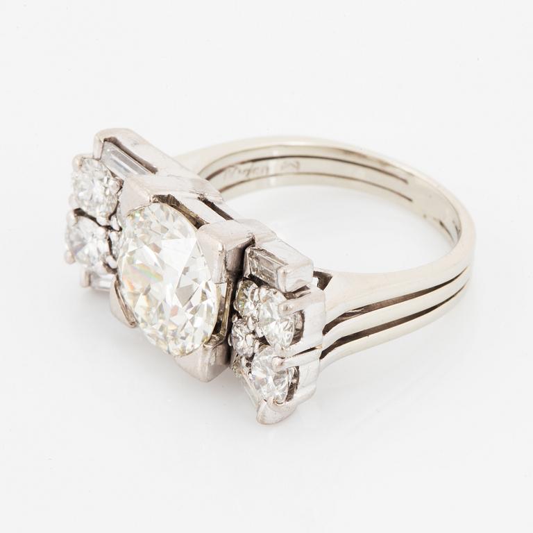 A baguette cut and old brilliant cut diamond ring.