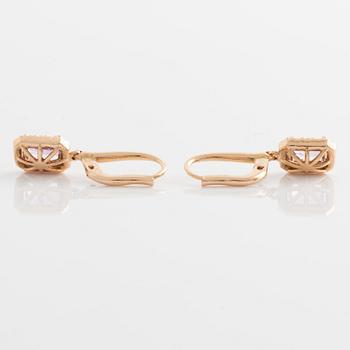 Earrings with pink sapphires and diamonds.