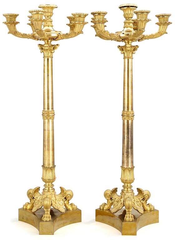 A pair of late Empire five-light candelabra.