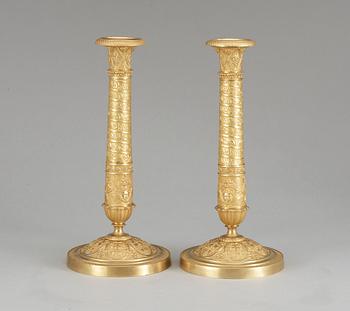 A pair of French Empire early 19th century candlesticks.