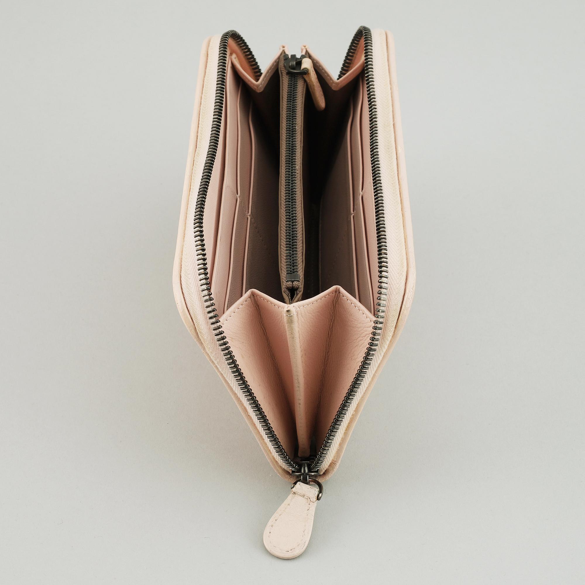 BOTTEGA VENETA, a intrecciato leather wallet.