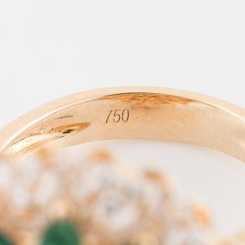 An marquise cut emerald and brilliant cut diamond ring.