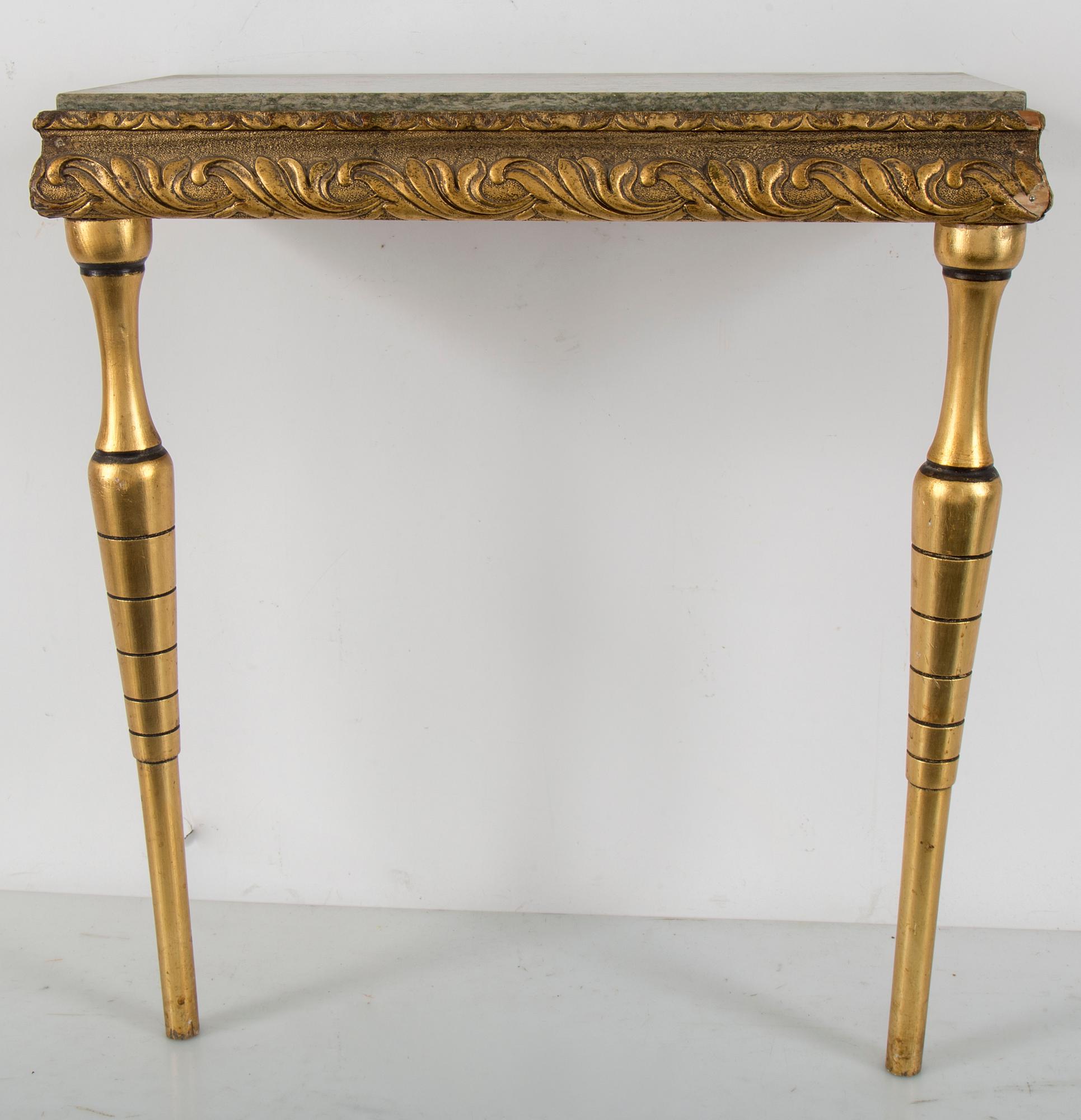 a bronzed mirror and a console table from the second half of the 20th century.