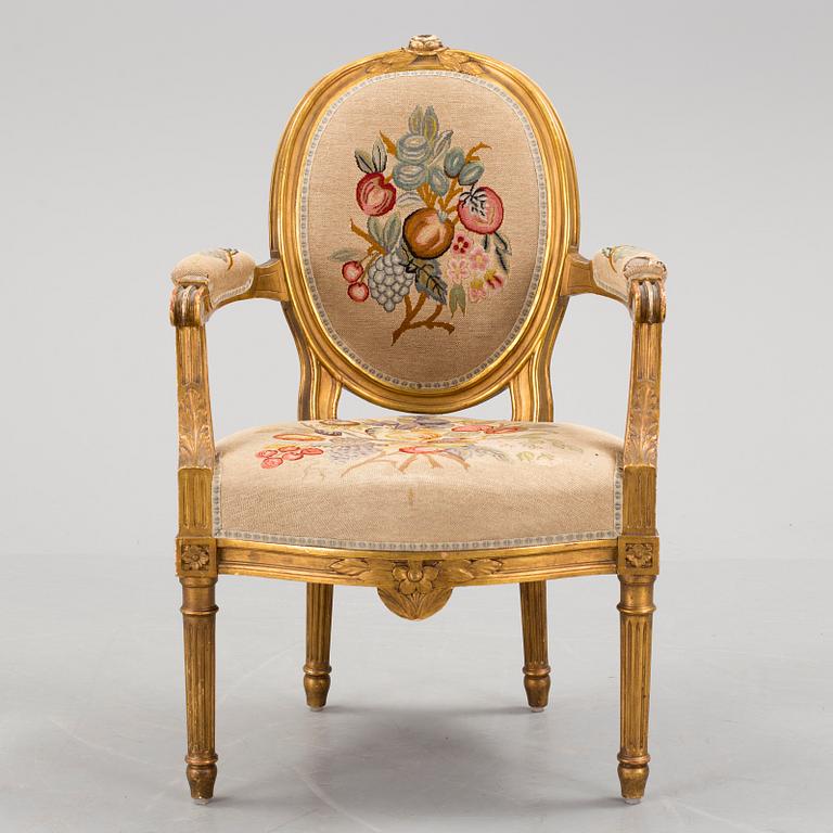 A Gustavian style arm chair, first half ot the 20th Century.
