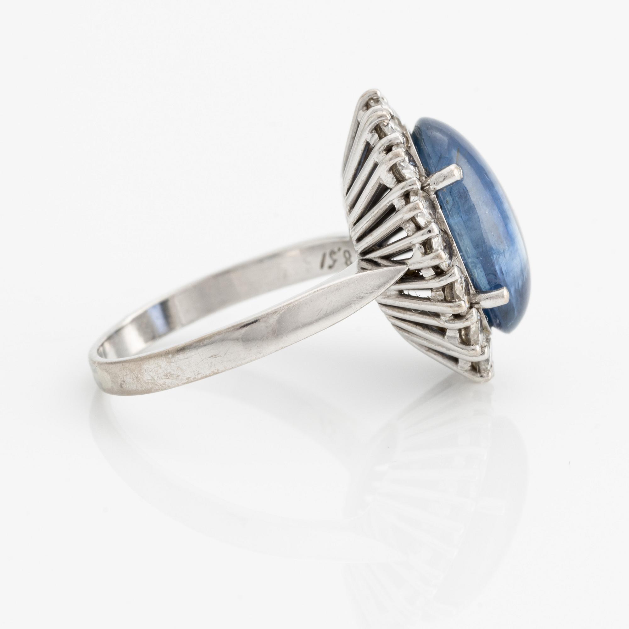 Ring with cabochon-cut sapphire and brilliant-cut diamonds.
