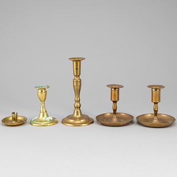 Five brass candlesticks, 18th/19th century.