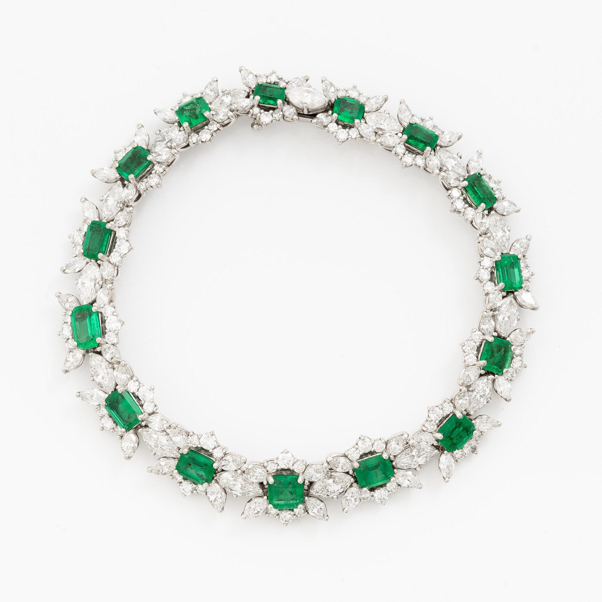 A bracelet in 18K white gold with step-cut emeralds and round and navette-shaped brilliant-cut diamonds.