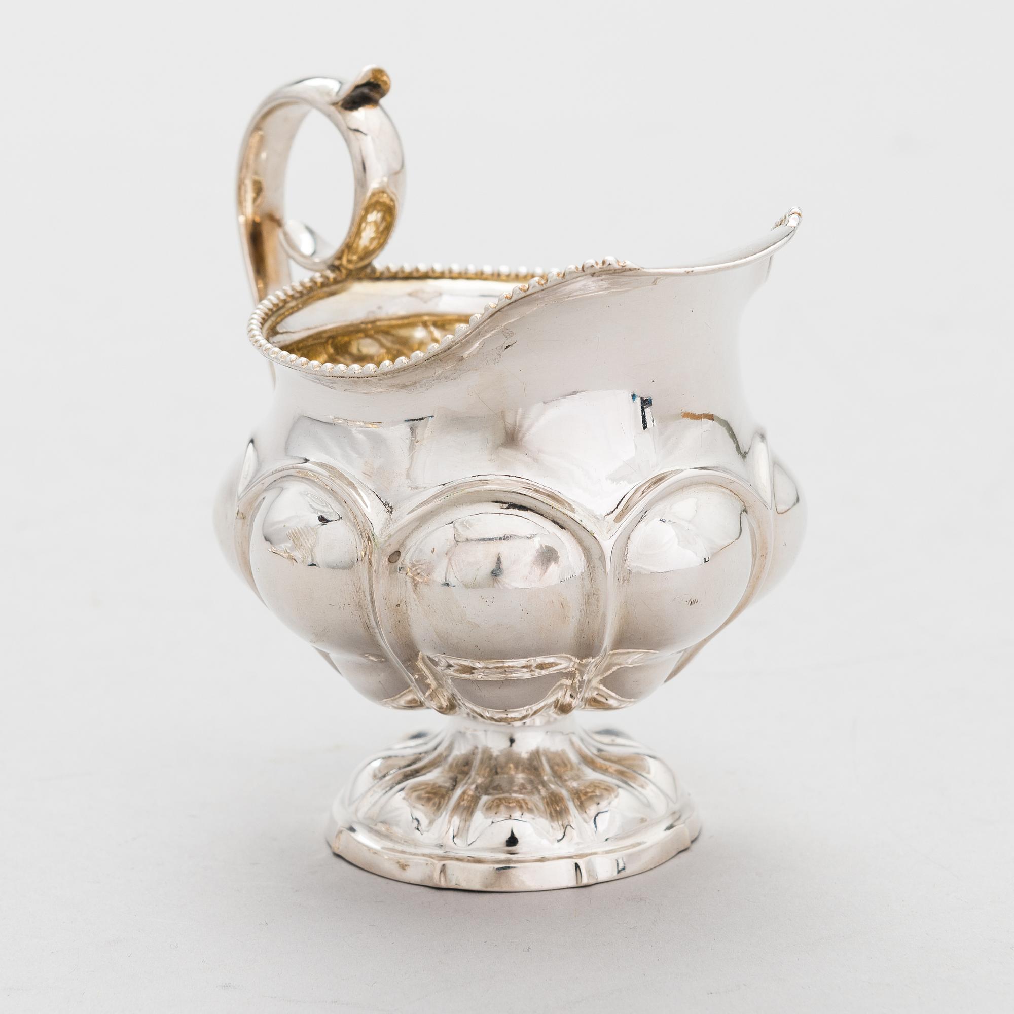 GUSTAF ADOLF BJÖRKLUND, Strösked, gräddsnäcka och skedar, silver, totalt 18 delar, Joensuu, Finland 1870.