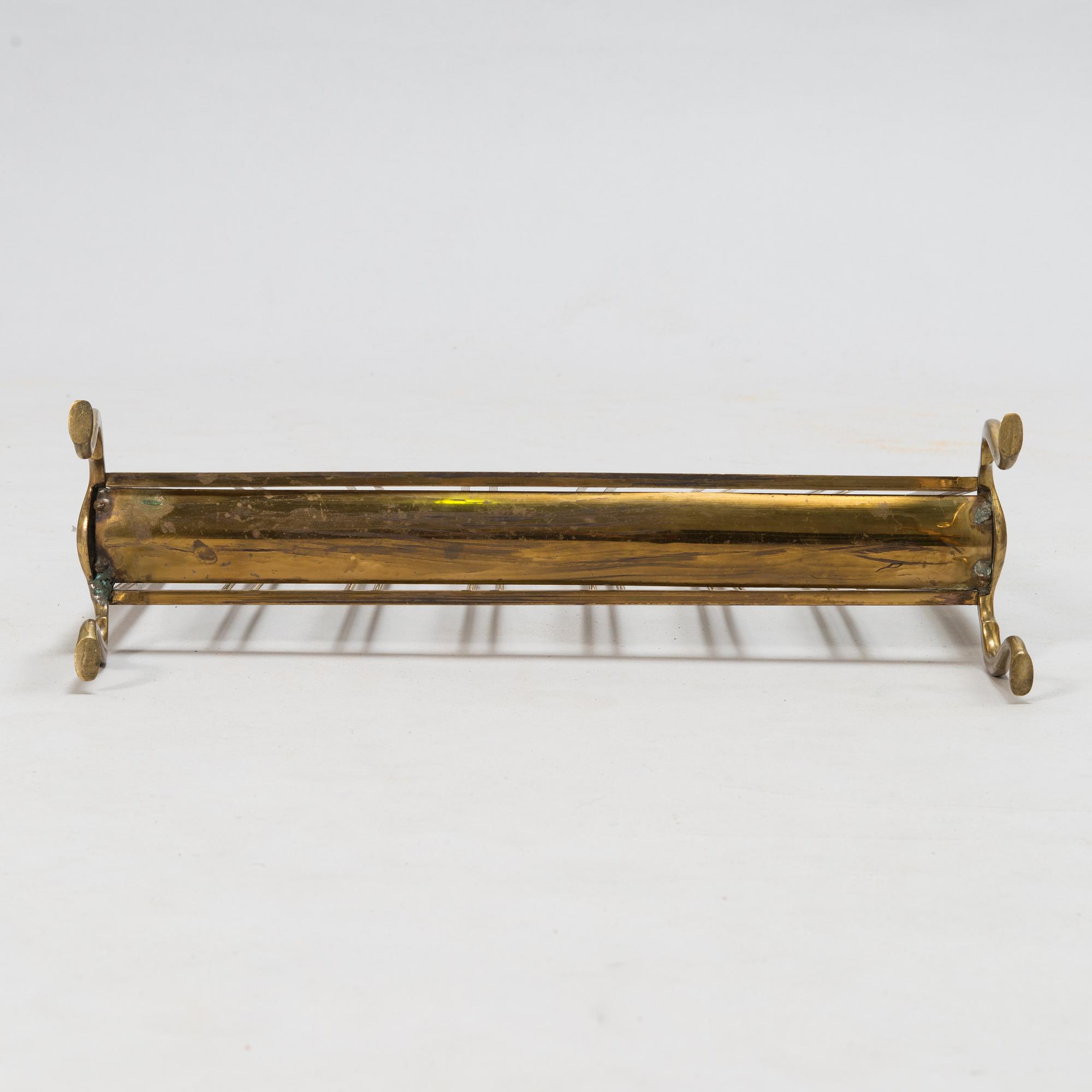 A folding brass magazine stand, first half of the 20th century.