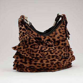 YVES SAINT LAURENT, a leopard and black leather shoulder bag.