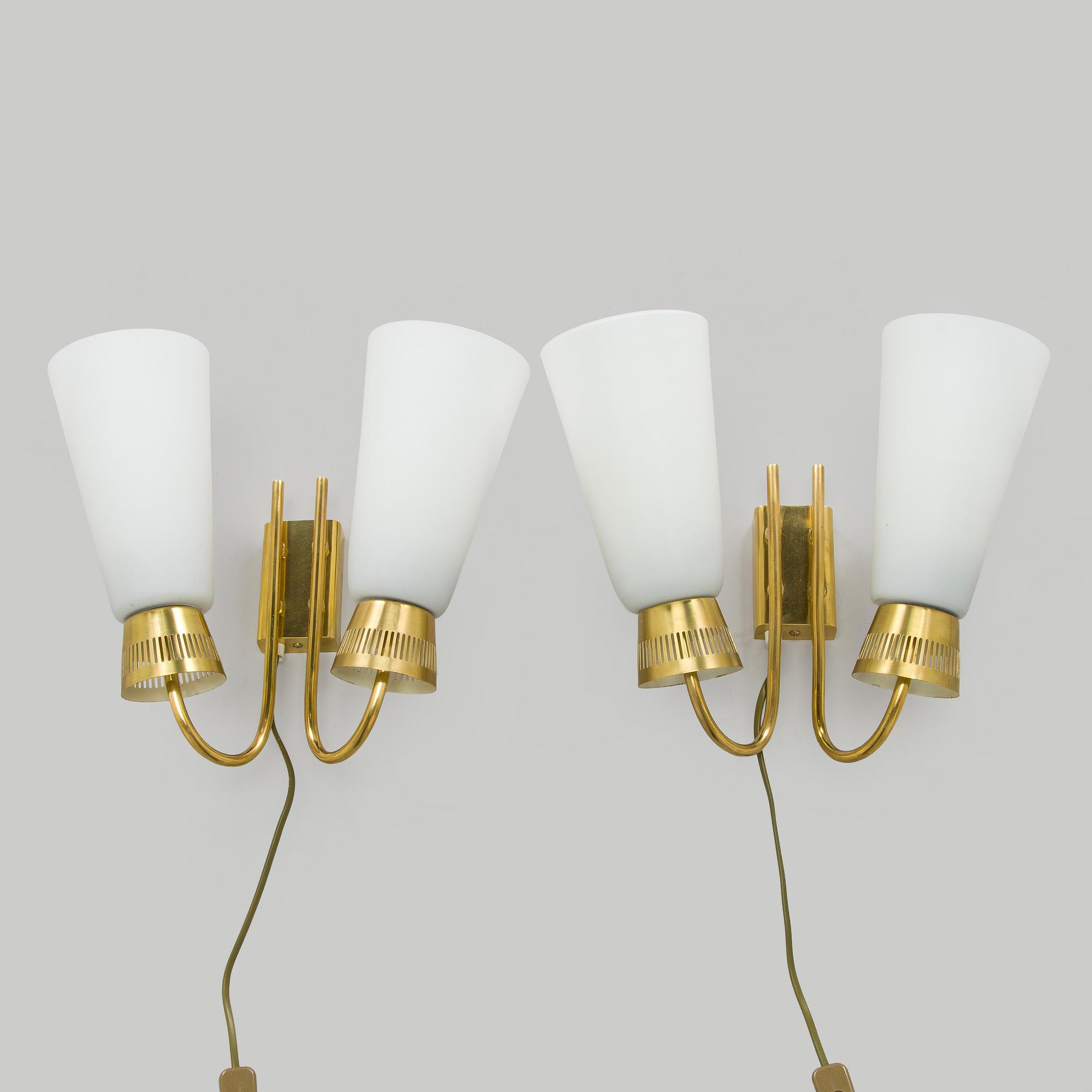 A pair of mid-20th century wall lights, model EY60, Itsu, Finland.