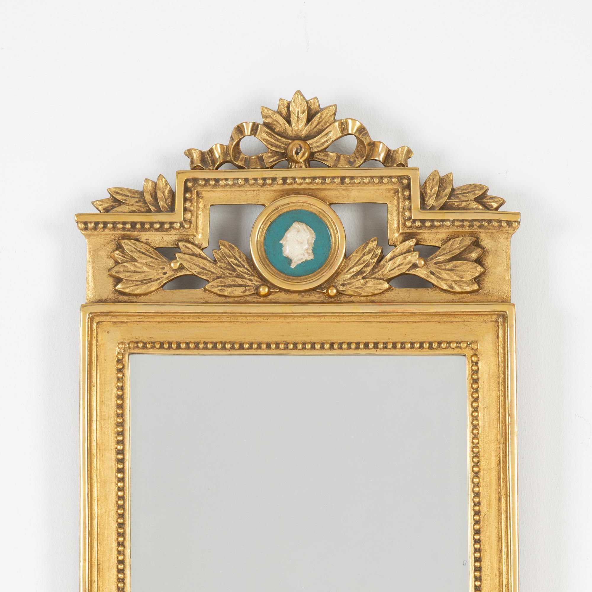 A Gustavian style mirror, mid 20th Century.