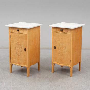 A pair of birch and marble top bedside tables, possibly  Axel Ståhls Möbelfabrik, Vimmerby, 1910's/20's.