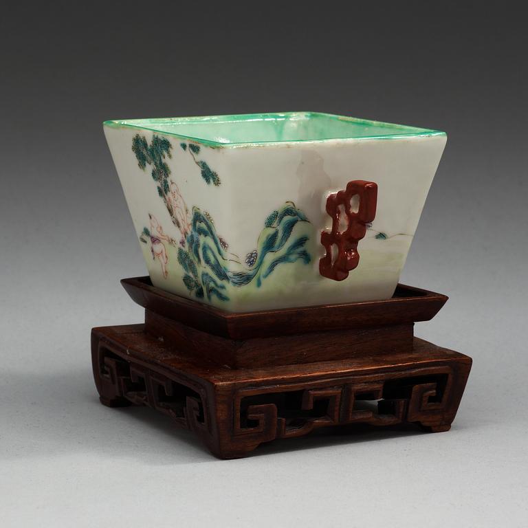 A famille rose cup with two handles, Qing dynasty with Qianlong mark.