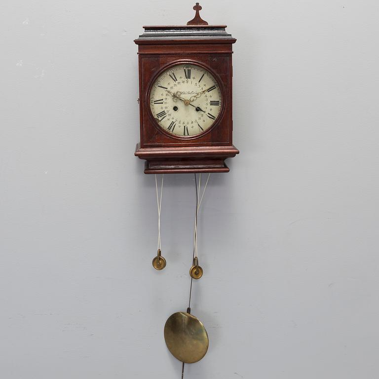A 19th century wall clock.