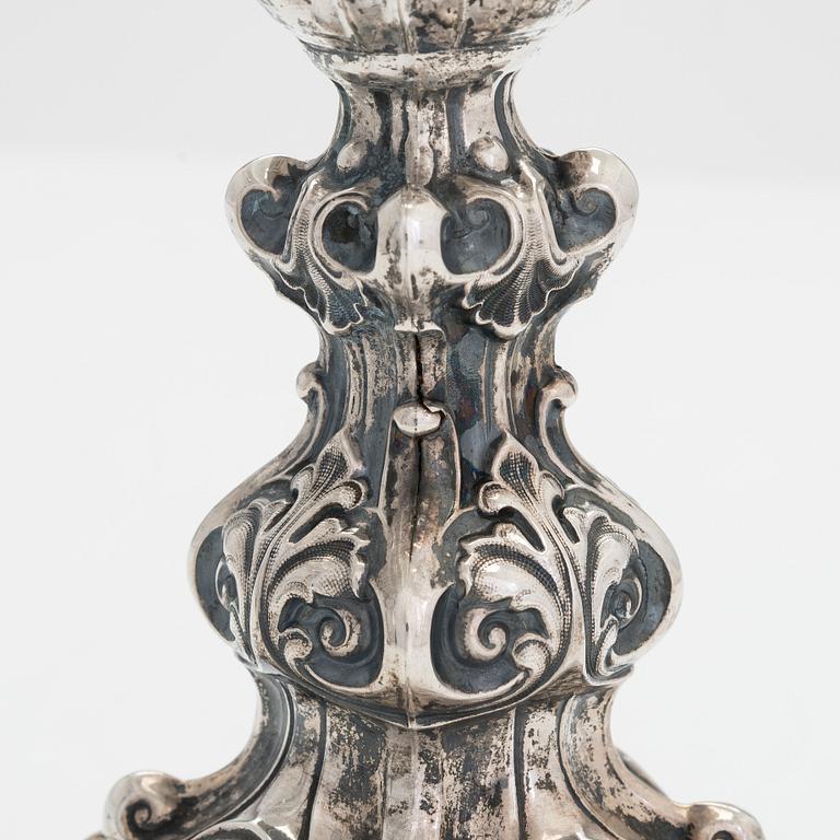 A pair of Neo Rococo silver candlesticks, maker's mark of Roland Mellin, Helsinki 1858.